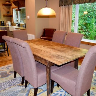 The Huntley features an Antique Kitchen Table - The Cove at Fairview Vacation Rentals - Asheville NC