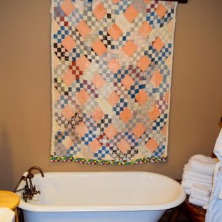 The Huntley Basement Bathroom features a Clawfoot Tub - The Cove at Fairview Vacation Rentals - Asheville NC