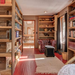 Western Bedroom features a small library - The Cove at Fairview Vacation Rentals - Asheville NC